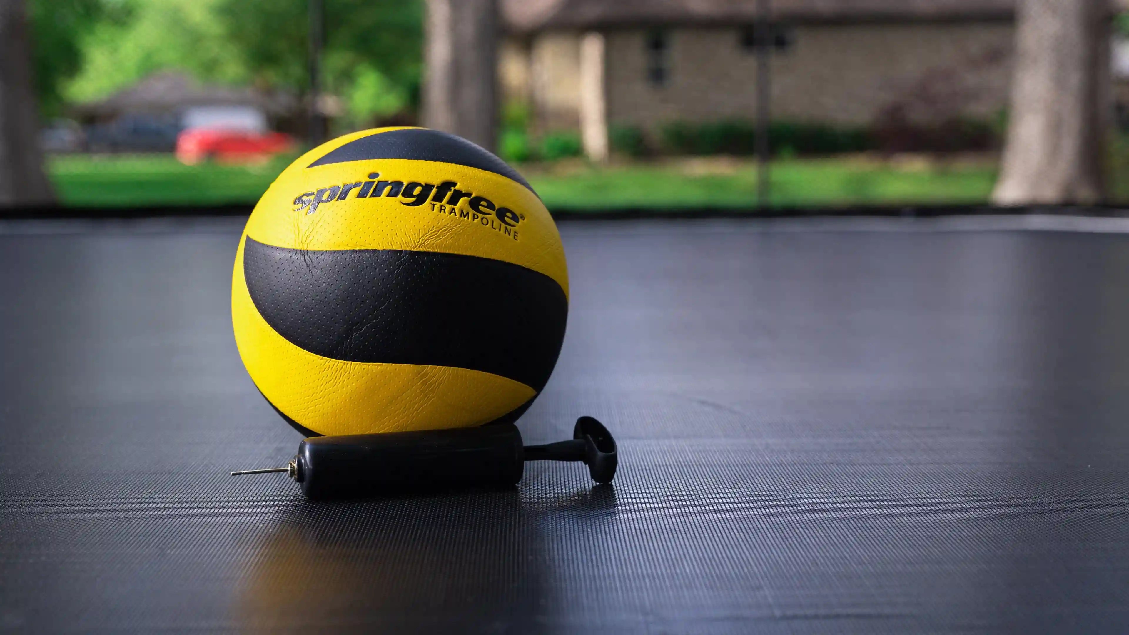 ball and pump on a trampoline